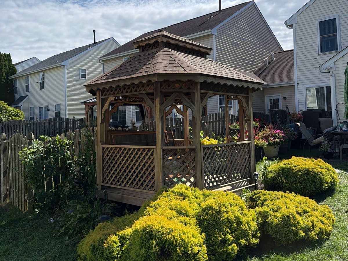 Restored cedar gazebo in a landscaped backyard